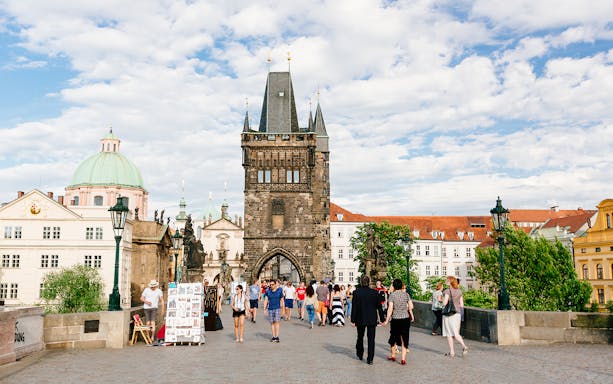 Charles Bridge with tourists walking, Prague day trip from Vienna.
