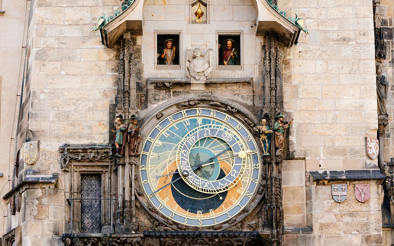 Astronomical Clock in Prague, featuring intricate details and figures, on a day trip from Vienna.