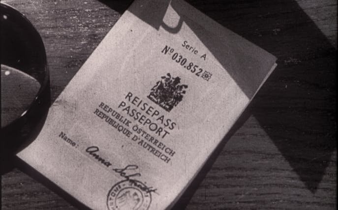 Austrian passport on a table, featured in The Third Man Film Location Tour.