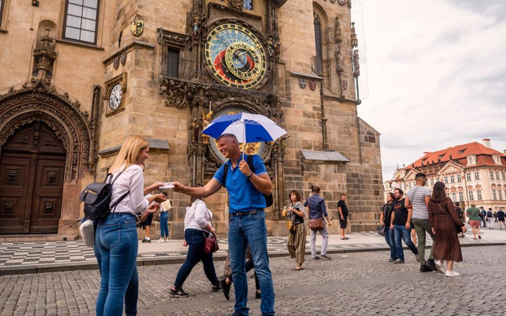 Tourists gather near the Astronomical Clock Tower in Prague.