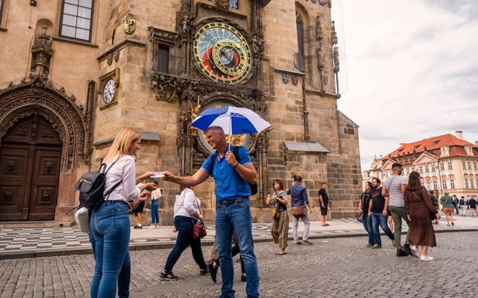 Tourists gather near the Astronomical Clock Tower in Prague.