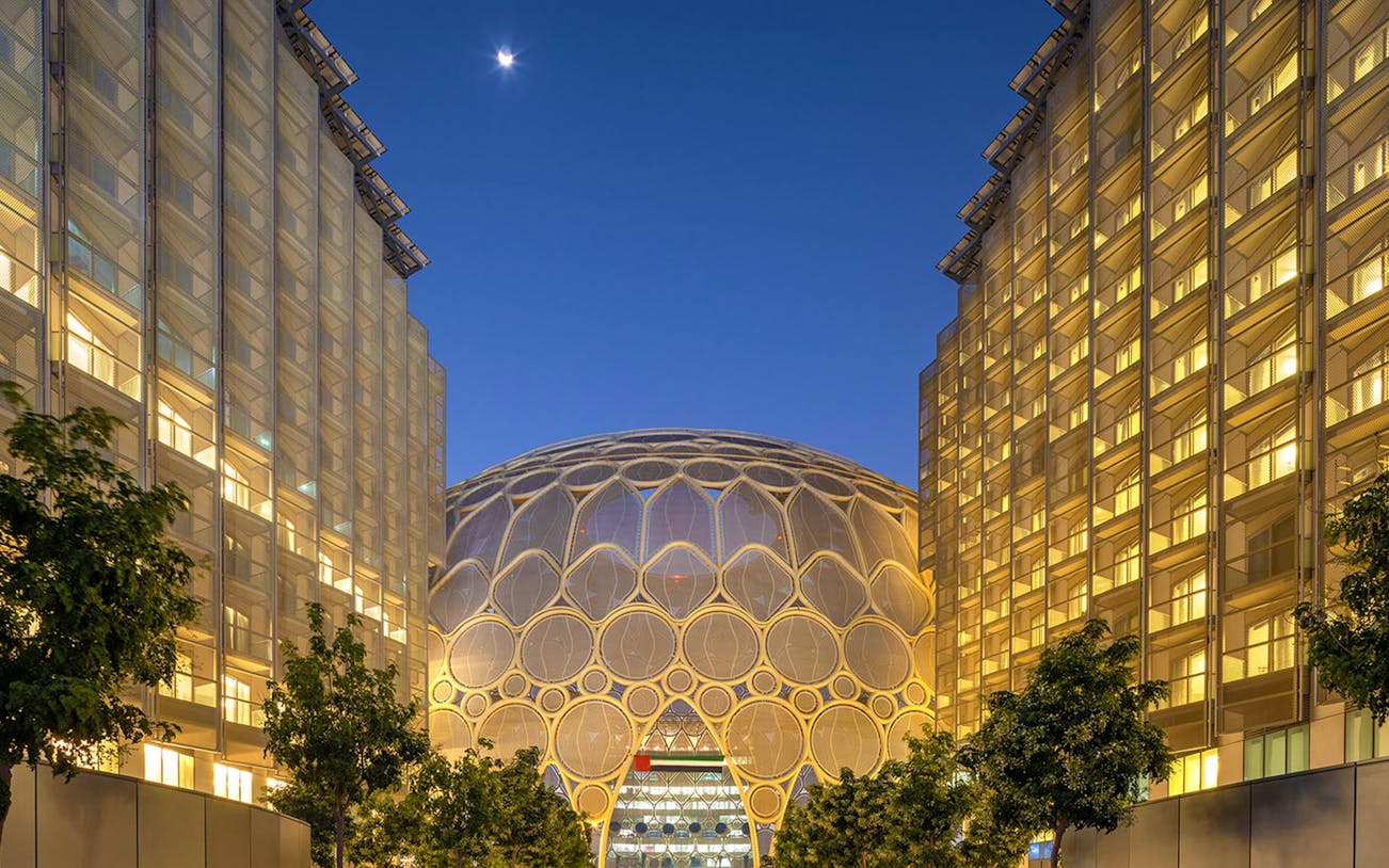 Al Wasl Plaza dome illuminated at night, Dubai Unlimited Attractions Pass.