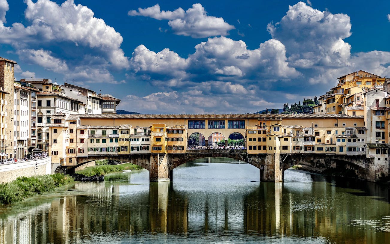 Ponte Vecchio bridge over the Arno River in Florence during a guided walking tour.