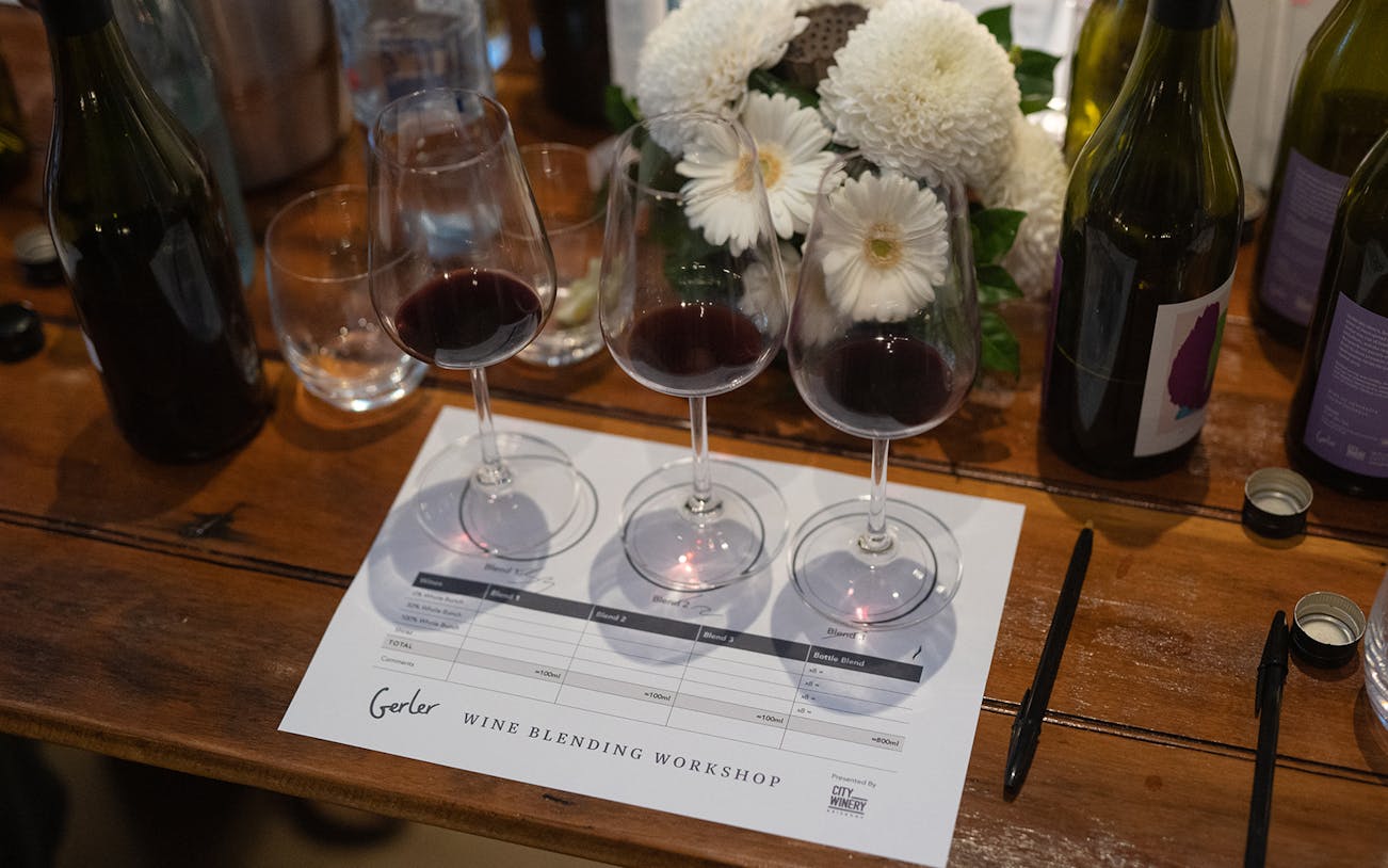 Wine glasses and bottles on a table at City Winery Wine Blending Workshop.