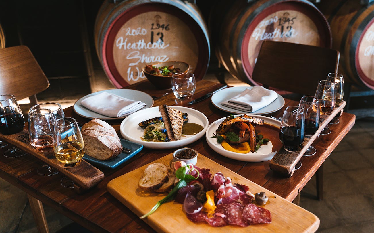 Wine tasting setup with lunch at City Winery, featuring wine glasses, charcuterie, and bread.