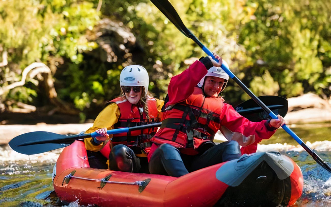 Kayakers paddling on Hobart's Twin Rivers during a 4km adventure tour.