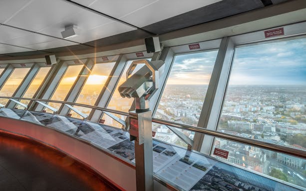 Berlin TV Tower observation deck with panoramic city view.
