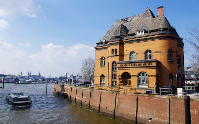 Historic building by the Elbe River in Hamburg, part of the Thriller Tour's crime scene exploration.