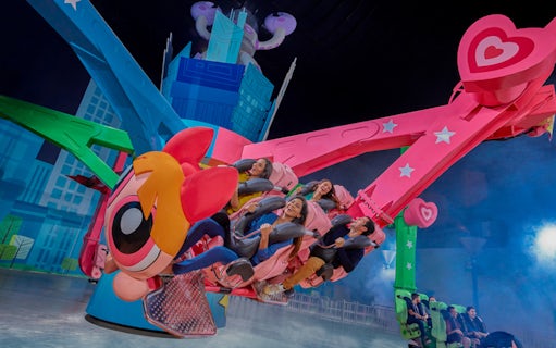 Visitors enjoying a colorful ride at IMG Worlds of Adventure in Dubai.