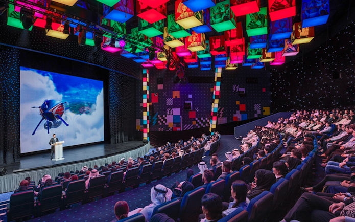 Audience watching a presentation at IMG Worlds of Adventure theater, Dubai.