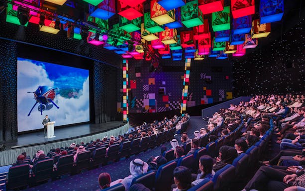 Audience watching a presentation at IMG Worlds of Adventure theater, Dubai.