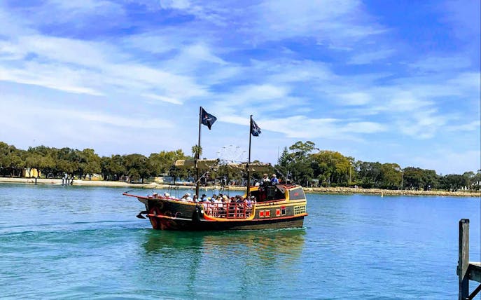 Pirate ship cruising in Mandurah waters during 1.5-hour fish and chips lunch tour.