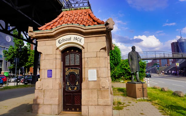Historic building and statue of Sir William Lindley in Hamburg, Germany.