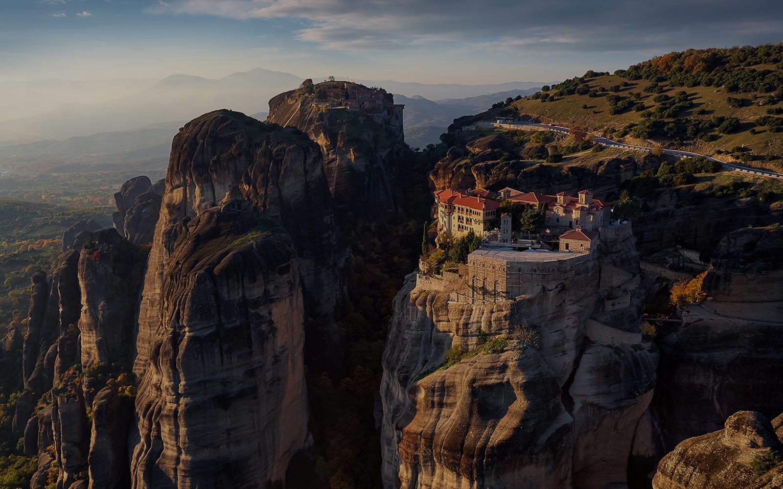 Meteora rock formations at sunset during a half-day tour in Greece.