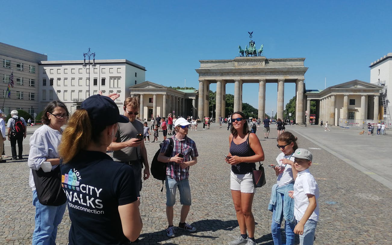 Group of tourists at Brandenburg Gate during Berlin walking tour.