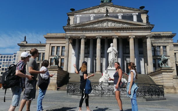 Group of tourists at Konzerthaus Berlin during a guided walking tour.