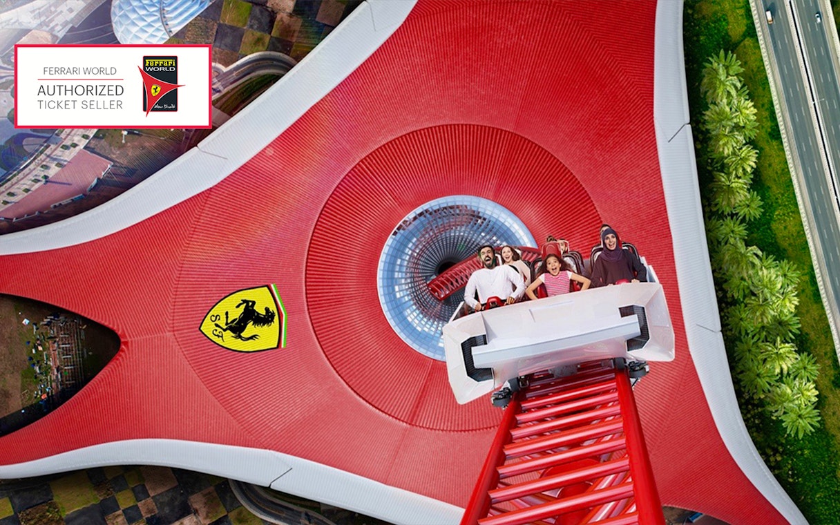 Roller coaster at Ferrari World Abu Dhabi with excited riders.