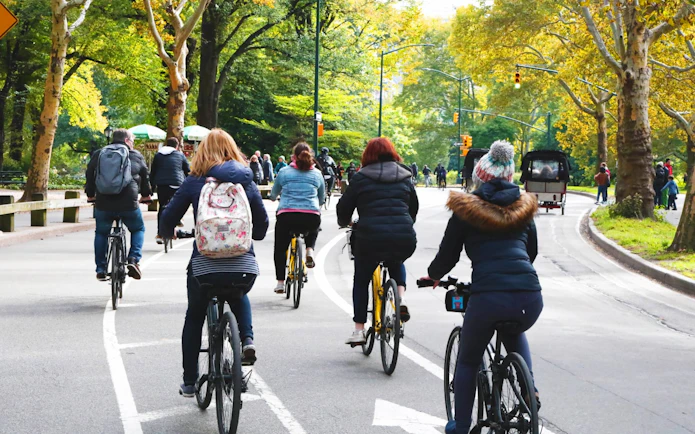 Cyclists riding through Central Park on a guided bike tour.