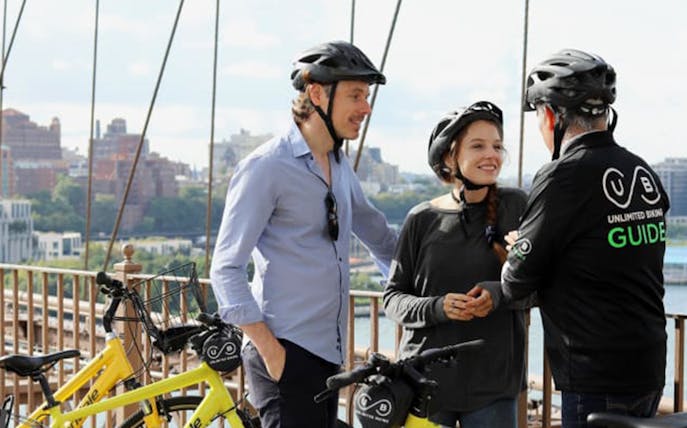 Cyclists with guide on Brooklyn Bridge during New York Highlights Bike Tour.