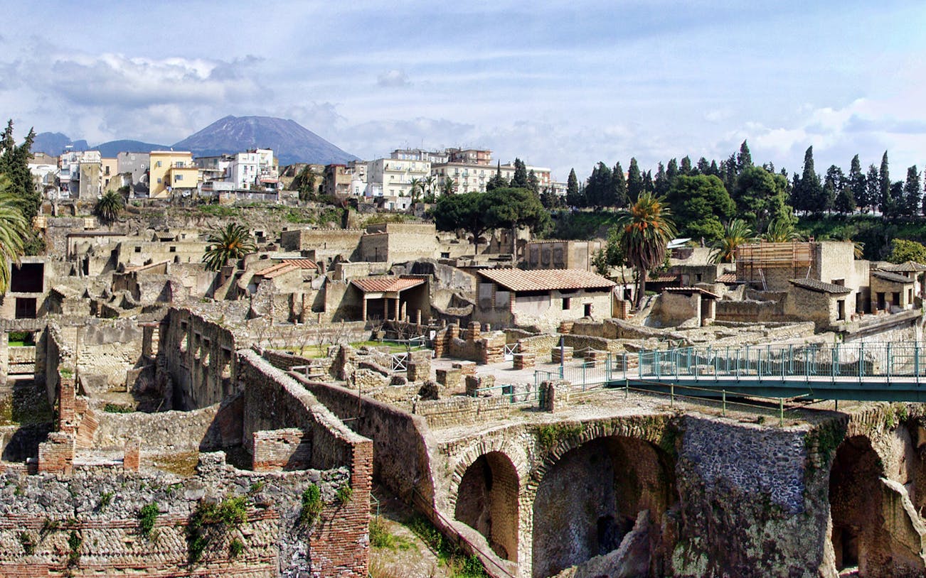 Herculaneum ruins with Mount Vesuvius in the background, part of the Official Audio Guide tour.