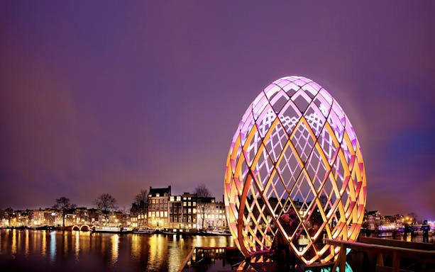 Illuminated art installation at Amsterdam Light Festival during semi-open boat cruise.