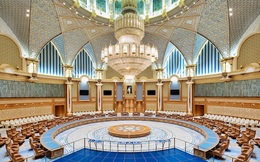 Qasr Al Watan's ornate meeting room with intricate ceiling and grand chandelier in Abu Dhabi.