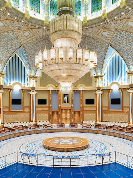 Qasr Al Watan's ornate meeting room with intricate ceiling and grand chandelier in Abu Dhabi.