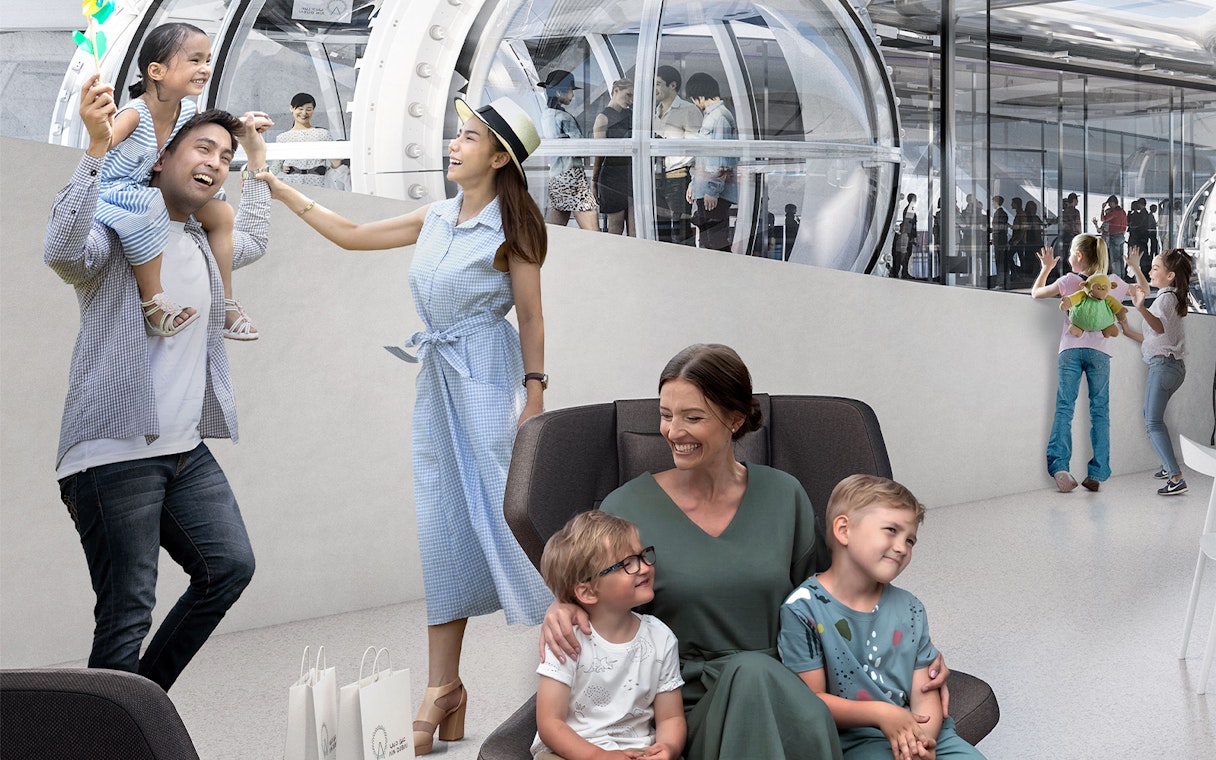 Families enjoying Ain Dubai Premium Cabin experience with children playing and people inside the cabin.