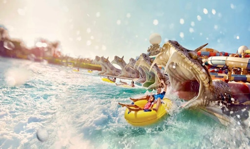 Yas Waterworld wave pool with visitors enjoying water activities in Abu Dhabi.