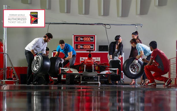 Team changing tires on a Formula 1 car at Ferrari World Abu Dhabi.