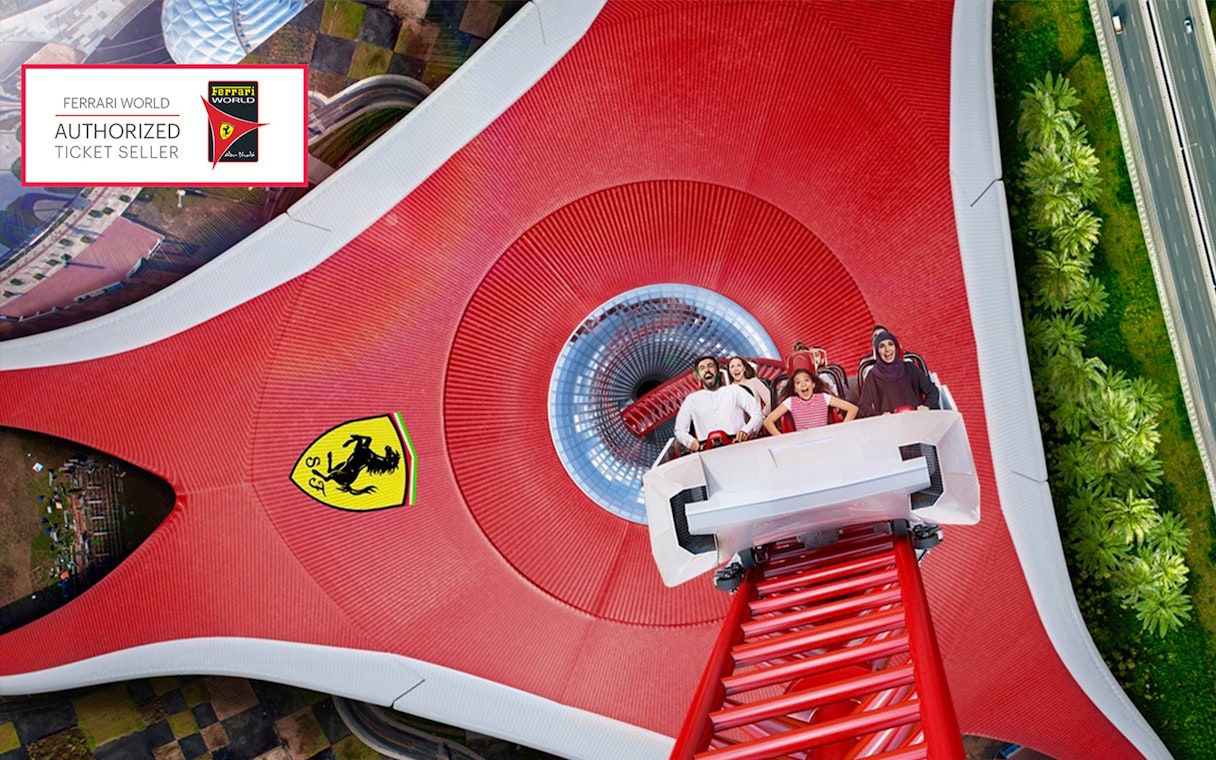 Roller coaster at Ferrari World Abu Dhabi with excited riders.