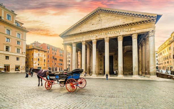 Pantheon in Rome with horse-drawn carriage in front, showcasing ancient architecture.