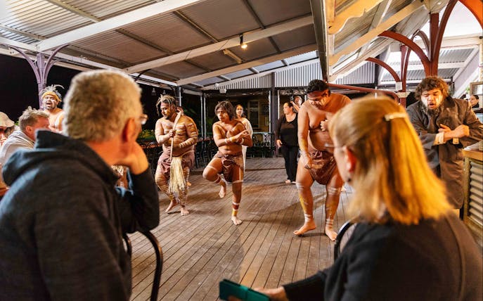 Performers in traditional attire at Spirits of the Red Sand Evening Theatre Show, Australia.