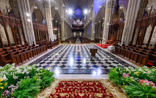 St. Patrick's Cathedral interior with ornate altar and stained glass, 5th Ave, New York City.