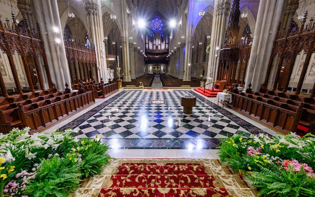 St. Patrick's Cathedral interior with ornate altar and stained glass, 5th Ave, New York City.