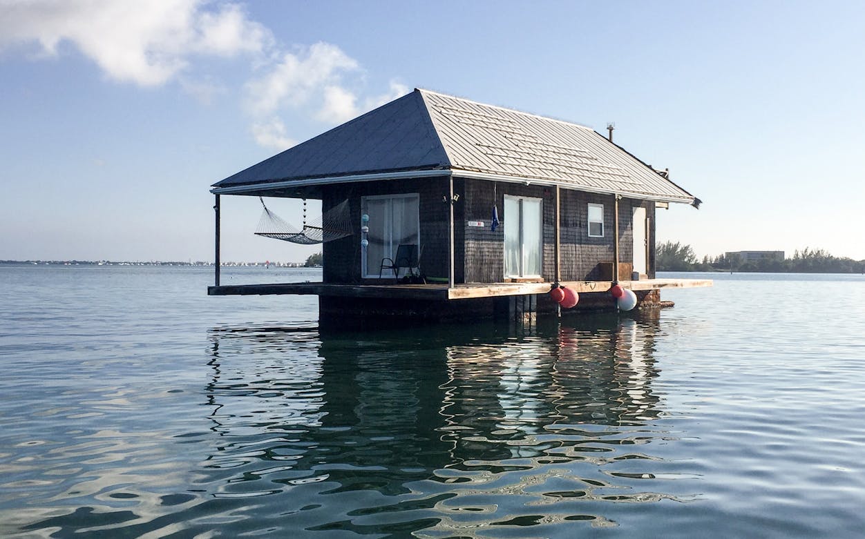 Floating house on water during Miami to Key West sightseeing bus tour.