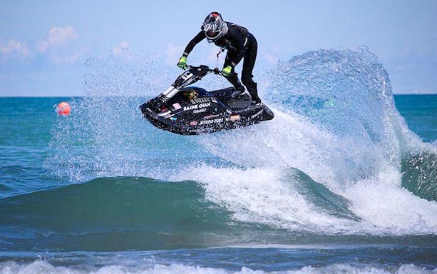 Jet ski rider jumping waves in Biscayne Bay, Miami during a 60-minute rental.