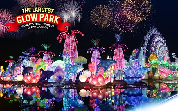 Dubai Garden Glow illuminated sculptures and fireworks at night.