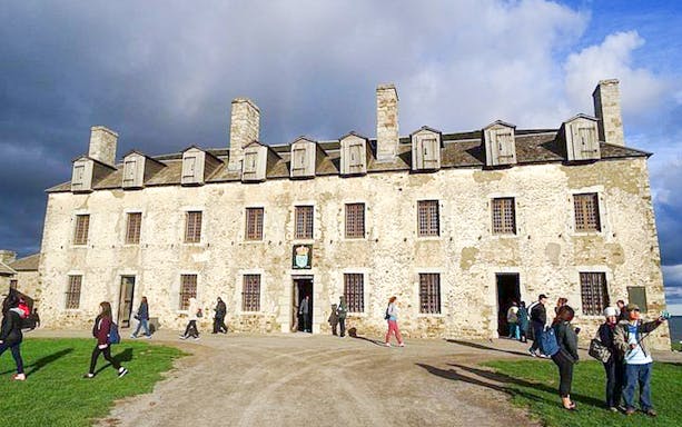 Old Fort Niagara historic building with visitors exploring the grounds, Niagara Falls USA tour.