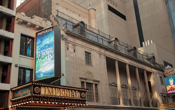 Imperial Theatre marquee in New York City, featuring a Broadway show advertisement.
