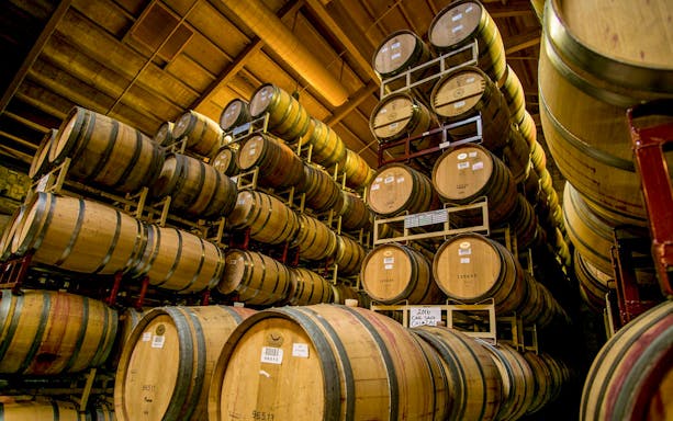 Wine barrels stacked in a Sonoma Valley winery cellar.
