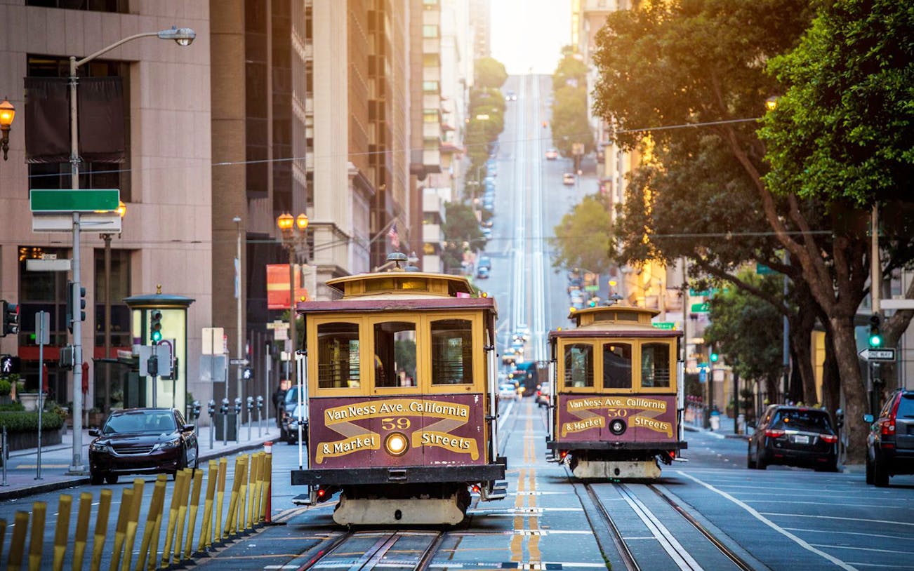 San Francisco cable cars on a steep street, part of Alcatraz Island and Chinatown tour.