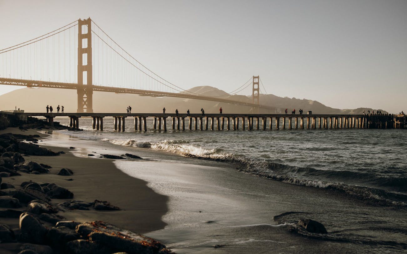 Golden Gate Bridge view from a beach near Fisherman's Wharf, San Francisco.