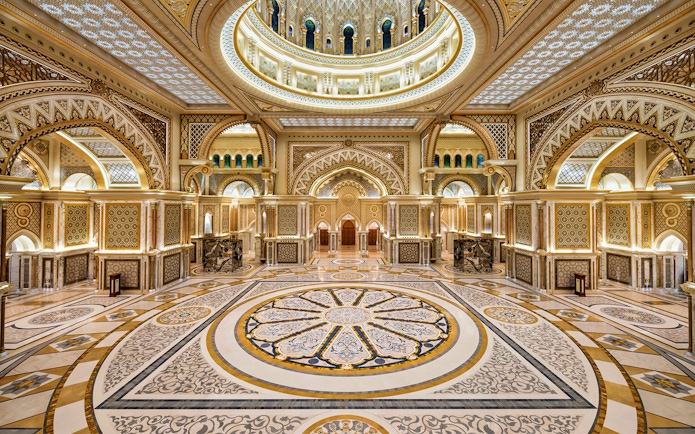 Ornate interior of Qasr Al Watan in Abu Dhabi, showcasing intricate patterns and grand architecture.