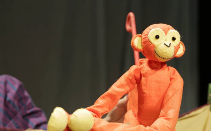 Orange monkey puppet from Five Little Christmas Monkeys show.