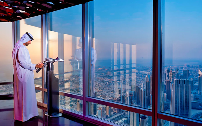 Viewing platform at Burj Khalifa with cityscape of Dubai.