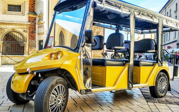 Golf cart parked in Krakow's Kazimierz Quarter for Jewish Ghetto tour.