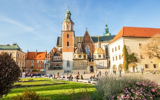 Krakow Wawel Castle courtyard with tourists, part of Old Town golf cart tour.