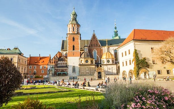 Krakow Wawel Castle courtyard with tourists, part of Old Town golf cart tour.