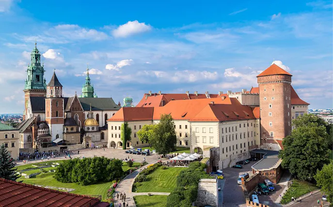 Wawel Castle complex in Krakow, featuring historic architecture and green courtyards.